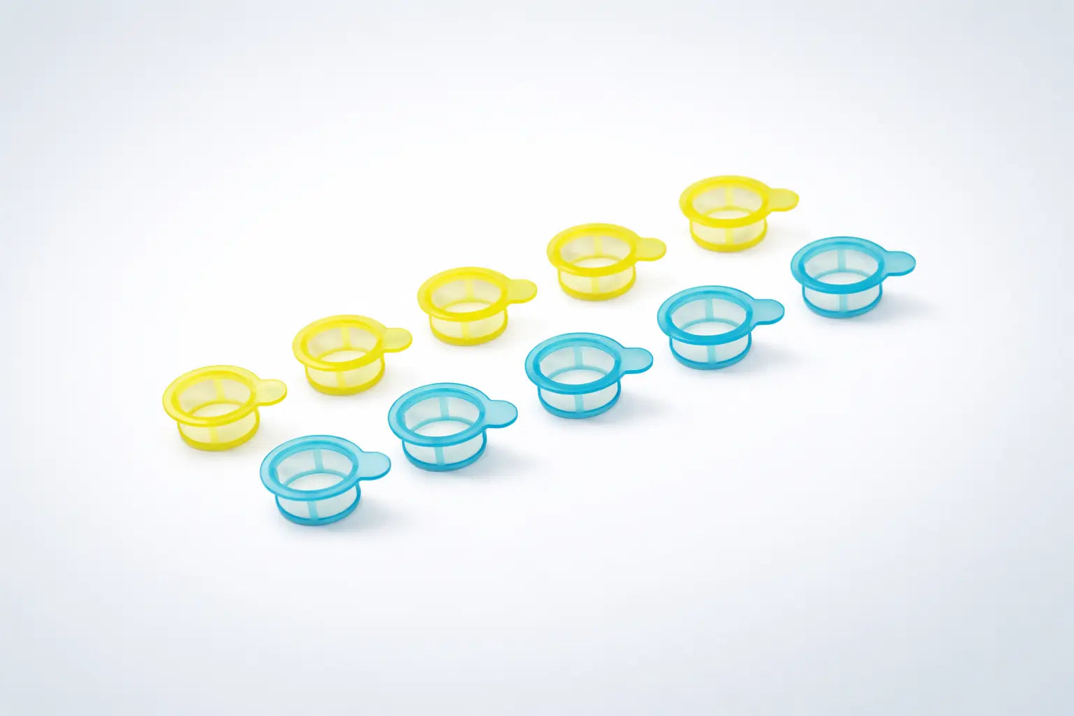 Set of small yellow and blue cell strainer made of clear, medical-grade polystyrene frame and high-purity nylon mesh for reliable filtration on a white background